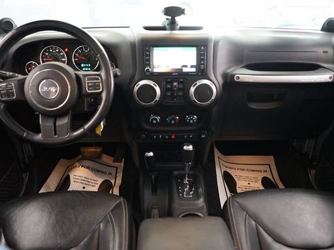 Used 2014 Jeep Wrangler Unlimited Sahara w/ Dual Top Group AWD/4WD image 36