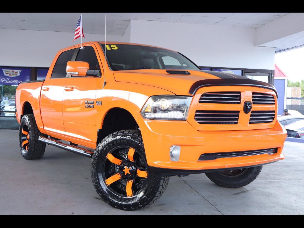 Used 2015 RAM 1500 Sport w/ Ignition Orange Sport Package AWD/4WD image 1