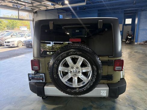 Used 2013 Jeep Wrangler Unlimited Sahara w/ Dual Top Group AWD/4WD image 10