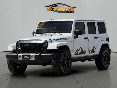 Used 2012 Jeep Wrangler Unlimited Sahara w/ Dual Top Group AWD/4WD image 1