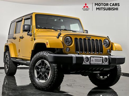 Used 2014 Jeep Wrangler Unlimited Sahara w/ Dual Top Group AWD/4WD image 1