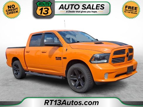 Used 2015 RAM 1500 Sport w/ Ignition Orange Sport Package AWD/4WD image 1