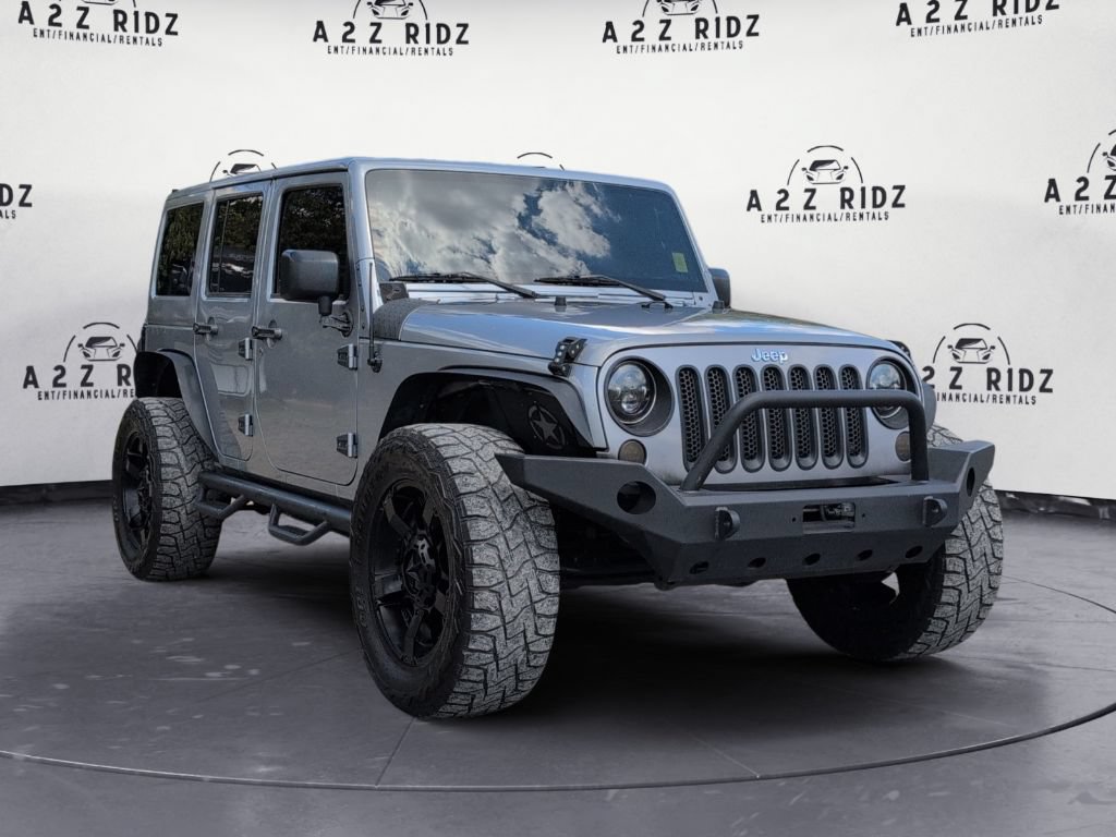 Used 2015 Jeep Wrangler Unlimited Sahara w/ Connectivity Group AWD/4WD image 1