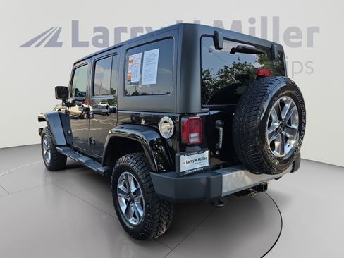 Used 2014 Jeep Wrangler Unlimited Sahara w/ Dual Top Group AWD/4WD image 3