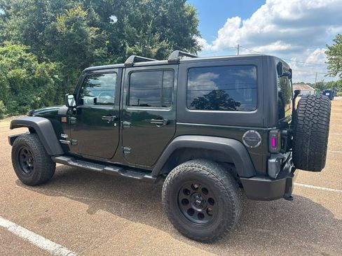 Used 2011 Jeep Wrangler Unlimited Sahara w/ Dual Top Group AWD/4WD image 3