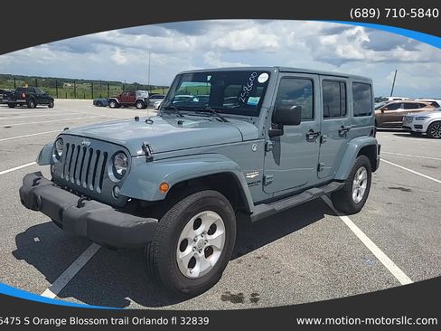 Used 2014 Jeep Wrangler Unlimited Sahara w/ Connectivity Group AWD/4WD image 1