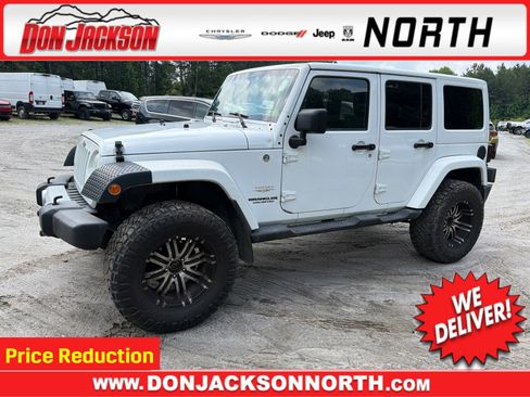 Used 2011 Jeep Wrangler Unlimited Sahara AWD/4WD image 1