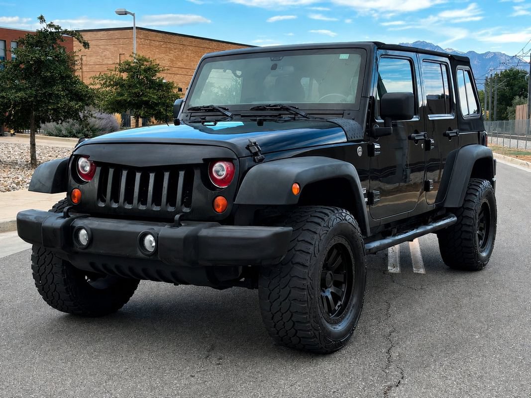 Used 2011 Jeep Wrangler Unlimited Sport AWD/4WD image 1