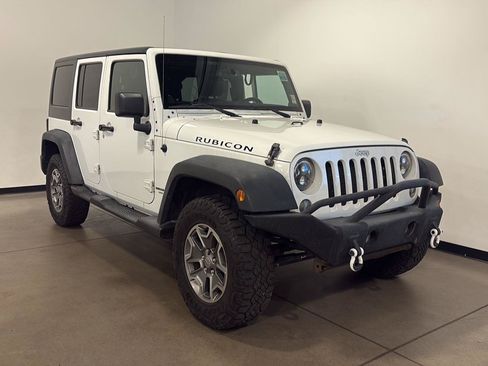 Used 2014 Jeep Wrangler Unlimited Rubicon w/ Dual Top Group AWD/4WD image 1
