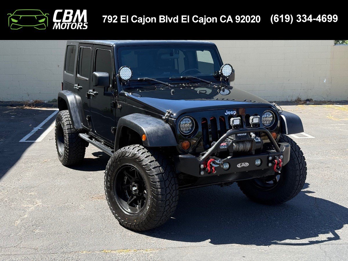 Used 2012 Jeep Wrangler Unlimited Sport w/ Max Tow Pkg AWD/4WD image 1
