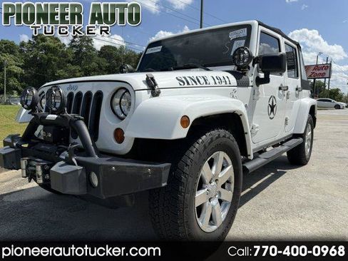 Used 2013 Jeep Wrangler Unlimited Sahara w/ Dual Top Group AWD/4WD image 1