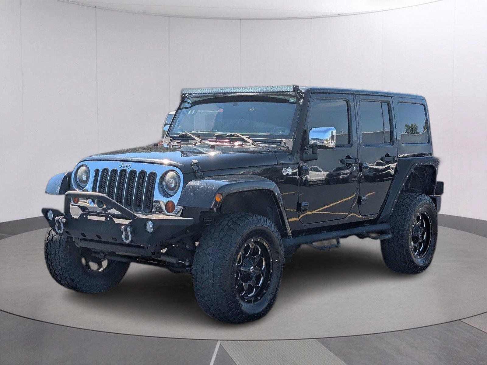 Used 2012 Jeep Wrangler Unlimited Sahara AWD/4WD image 1