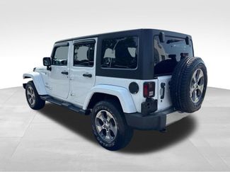 Used 2016 Jeep Wrangler Unlimited Sahara w/ Dual Top Group AWD/4WD video 4