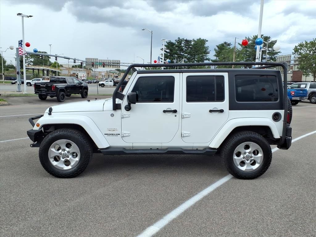 Used 2015 Jeep Wrangler Unlimited Sahara w/ Dual Top Group AWD/4WD image 2
