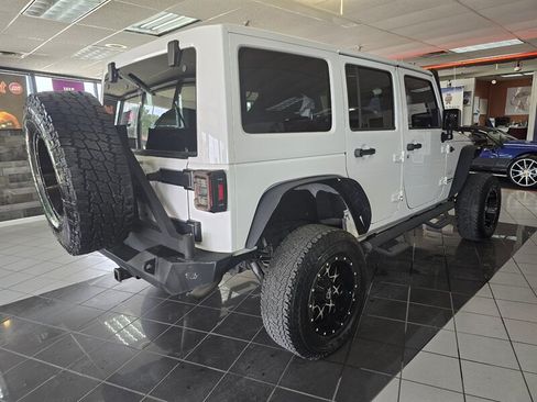 Used 2015 Jeep Wrangler Unlimited Sahara w/ Dual Top Group AWD/4WD image 4