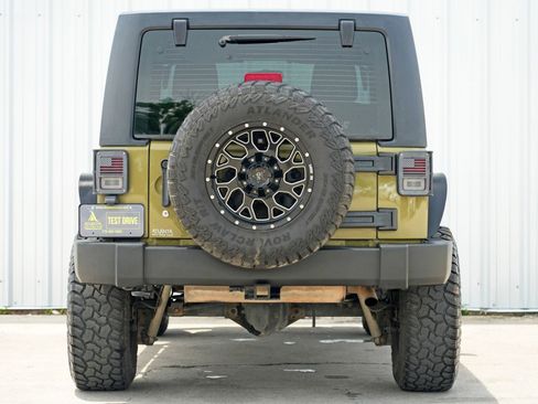 Used 2013 Jeep Wrangler Unlimited Sport w/ Mopar Black Appearance Group image 42