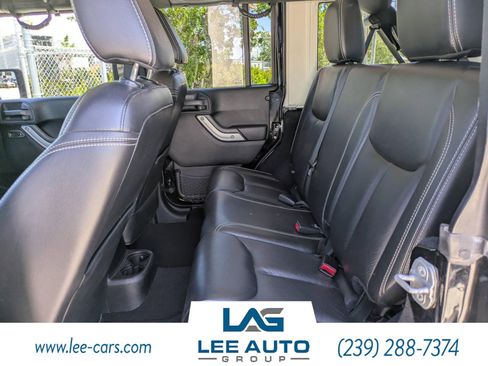 Used 2014 Jeep Wrangler Unlimited Sahara w/ Dual Top Group AWD/4WD image 11