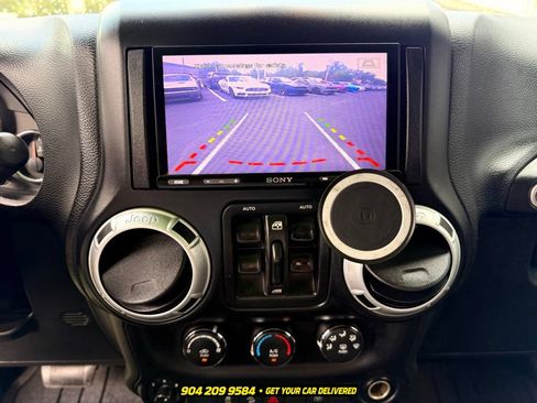 Used 2013 Jeep Wrangler Unlimited Sahara w/ Dual Top Group AWD/4WD image 14