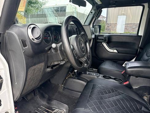 Used 2012 Jeep Wrangler Unlimited Sahara w/ Dual Top Group AWD/4WD image 11