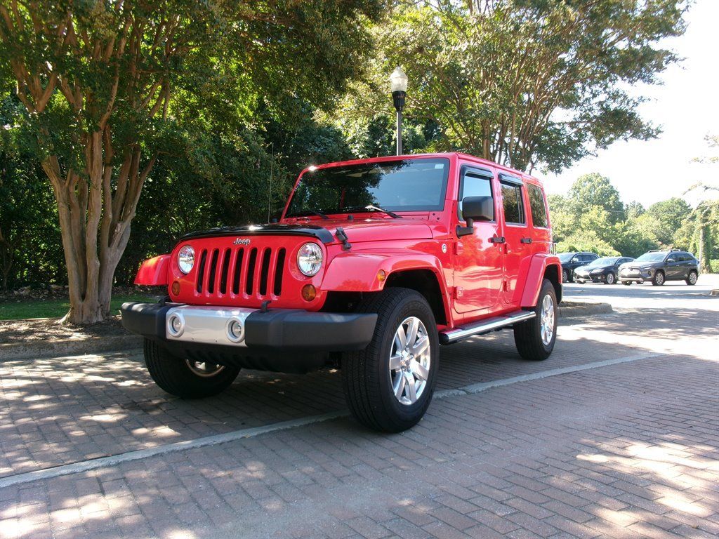 Used 2013 Jeep Wrangler Unlimited Sahara w/ Mopar Chrome Edition Group AWD/4WD image 1