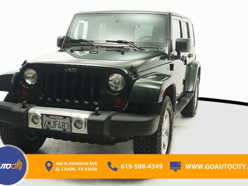 Used 2011 Jeep Wrangler Unlimited Sahara w/ Trailer Tow Group AWD/4WD image 1