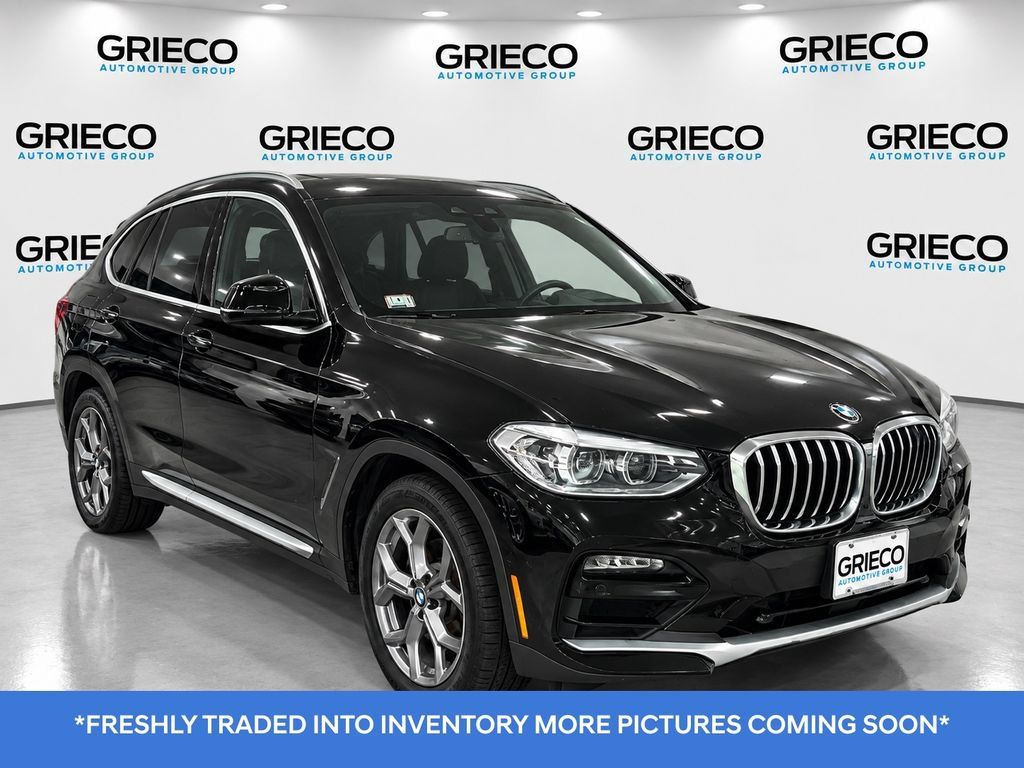 Used 2021 BMW X4 xDrive30i w/ Premium Package AWD/4WD image 1