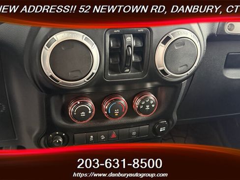 Used 2014 Jeep Wrangler Unlimited Sahara w/ Dual Top Group AWD/4WD image 16