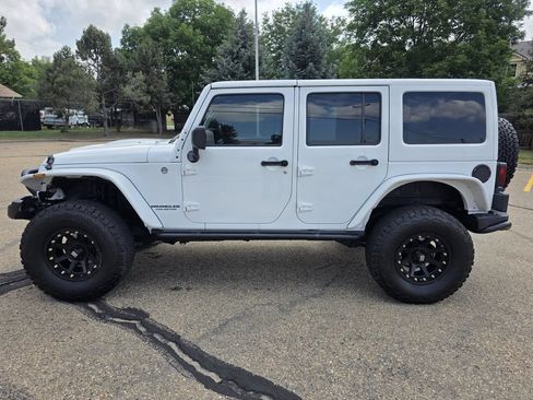 Used 2013 Jeep Wrangler Unlimited Sahara w/ Dual Top Group AWD/4WD image 2