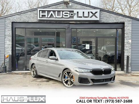 Used 2022 BMW M550i xDrive w/ Executive Package image 1