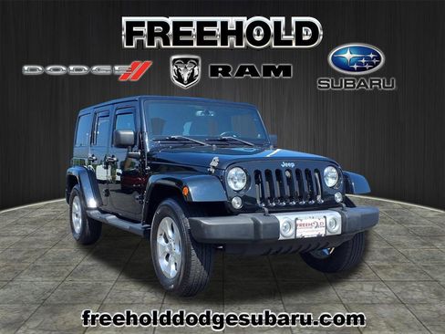Used 2014 Jeep Wrangler Unlimited Sahara w/ Dual Top Group image 1