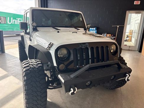 Used 2011 Jeep Wrangler Unlimited Sahara w/ Mopar Chrome Edition Group AWD/4WD image 1