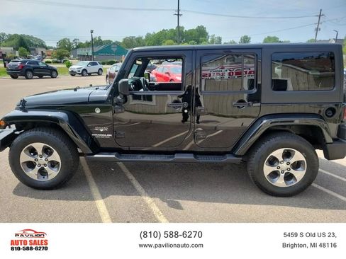 Used 2016 Jeep Wrangler Unlimited Sahara w/ Dual Top Group AWD/4WD image 1