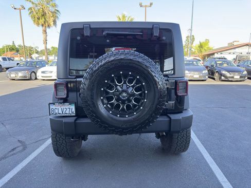 Used 2018 Jeep Wrangler Unlimited Sport w/ Mopar Black Appearance Group AWD/4WD image 4