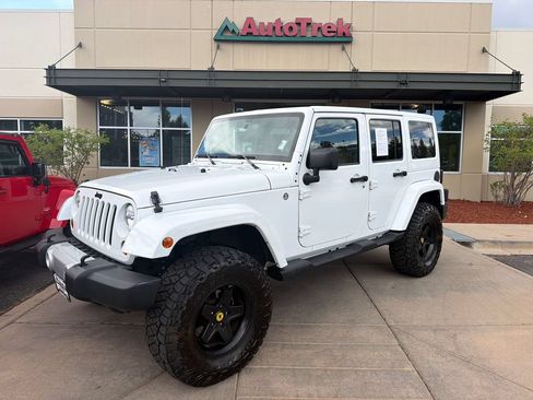 Used 2013 Jeep Wrangler Unlimited Sahara w/ Dual Top Group AWD/4WD image 1