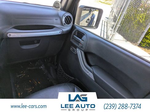 Used 2014 Jeep Wrangler Unlimited Sahara w/ Dual Top Group AWD/4WD image 14