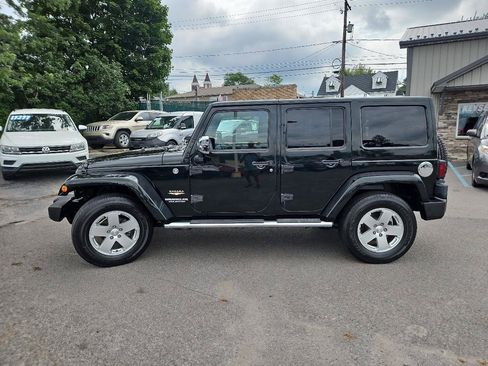 Used 2012 Jeep Wrangler Unlimited Sahara w/ Dual Top Group AWD/4WD image 6