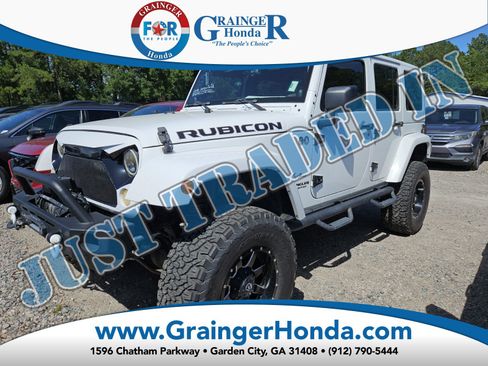 Used 2013 Jeep Wrangler Unlimited Rubicon w/ Dual Top Group AWD/4WD image 1