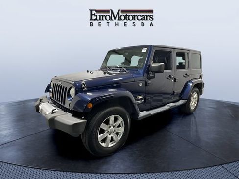 Used 2013 Jeep Wrangler Unlimited Sahara w/ Dual Top Group AWD/4WD image 1