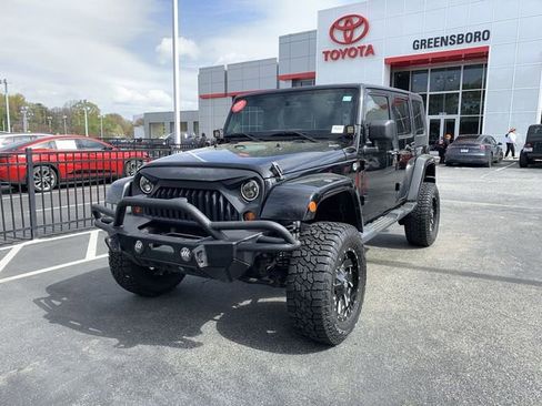 Used 2013 Jeep Wrangler Unlimited Sahara w/ Dual Top Group image 1