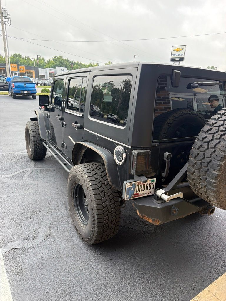 Used 2011 Jeep Wrangler Unlimited Rubicon w/ Dual Top Group AWD/4WD image 5
