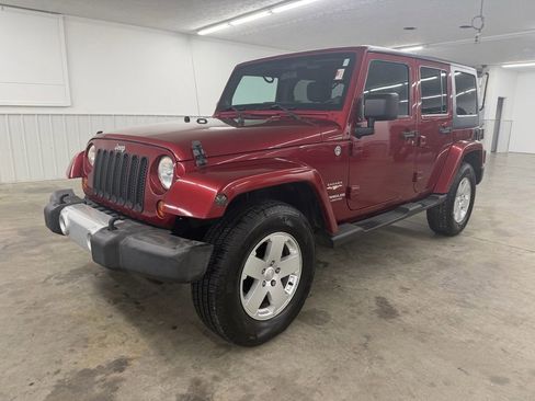 Used 2012 Jeep Wrangler Unlimited Sahara w/ Dual Top Group AWD/4WD image 1