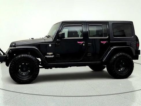 Used 2012 Jeep Wrangler Unlimited Sahara w/ Dual Top Group AWD/4WD image 8