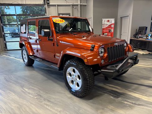 Used 2014 Jeep Wrangler Unlimited Sahara w/ Dual Top Group AWD/4WD image 1