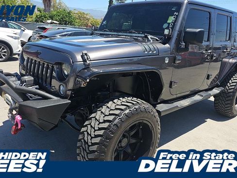 Used 2014 Jeep Wrangler Unlimited Sahara w/ Connectivity Group AWD/4WD image 1