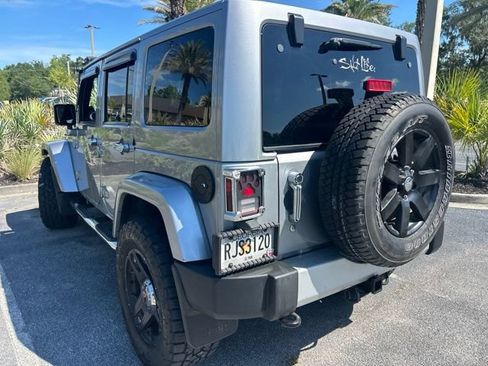 Used 2013 Jeep Wrangler Unlimited Sahara w/ Dual Top Group AWD/4WD image 9