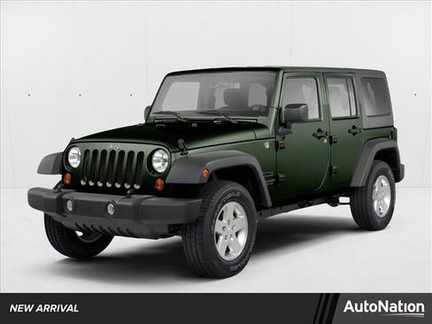 Used 2012 Jeep Wrangler Unlimited Sahara w/ Dual Top Group AWD/4WD image 1