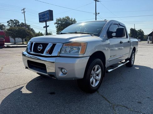 Used 2012 Nissan Titan SV w/ SV Premium Utility Pkg AWD/4WD image 1