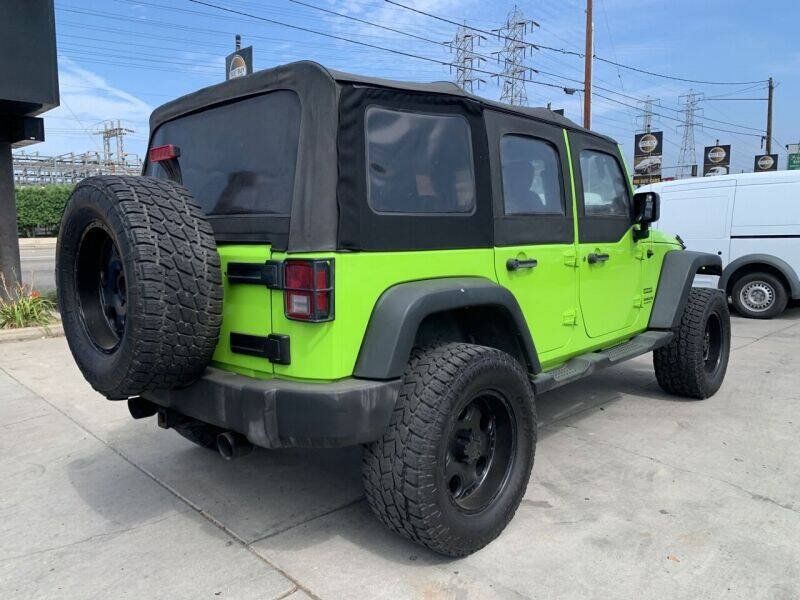 Used 2013 Jeep Wrangler Unlimited Sport w/ Mopar Black Appearance Group AWD/4WD image 8