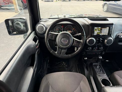 Used 2015 Jeep Wrangler Unlimited Sahara w/ Dual Top Group AWD/4WD image 14