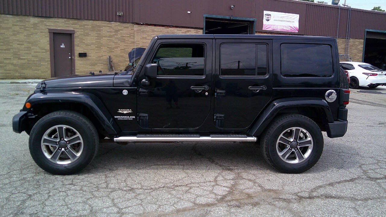 Used 2014 Jeep Wrangler Unlimited Sahara w/ Dual Top Group AWD/4WD image 8